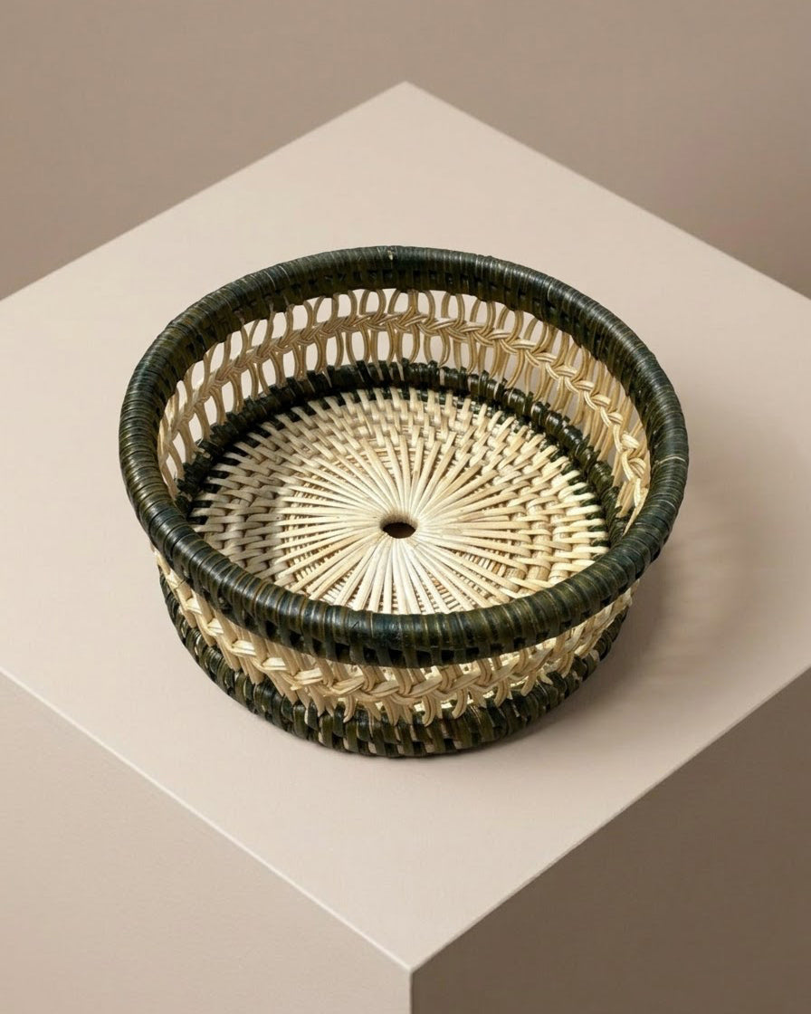 Round woven wine coaster with a dark green outer rim and a natural rattan inner weave | Anboise