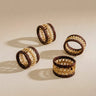 Four woven napkin rings with burgundy accents | Anboise