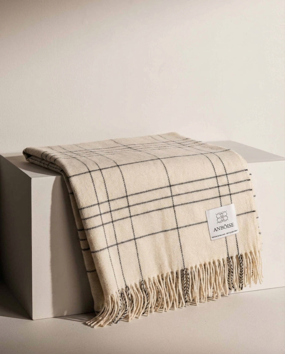 100% Merino wool throw in a white and black check. Woven in Ireland for Anbôise. Soft, warm and breathable — perfect for sofa, armchair or bed - Anboise