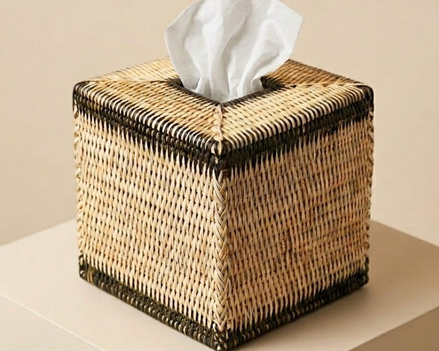 A hand‑woven rattan tissue box with dark olive accents. Natural, sculptural and artisanal — a refined detail for bathrooms, bedrooms and living spaces | Anboise
