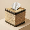 A hand‑woven rattan tissue box with dark olive accents. Natural, sculptural and artisanal — a refined detail for bathrooms, bedrooms and living spaces | Anboise