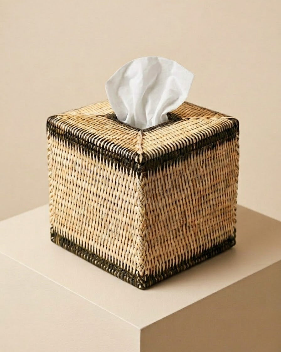 A hand‑woven rattan tissue box with dark olive accents. Natural, sculptural and artisanal — a refined detail for bathrooms, bedrooms and living spaces | Anboise