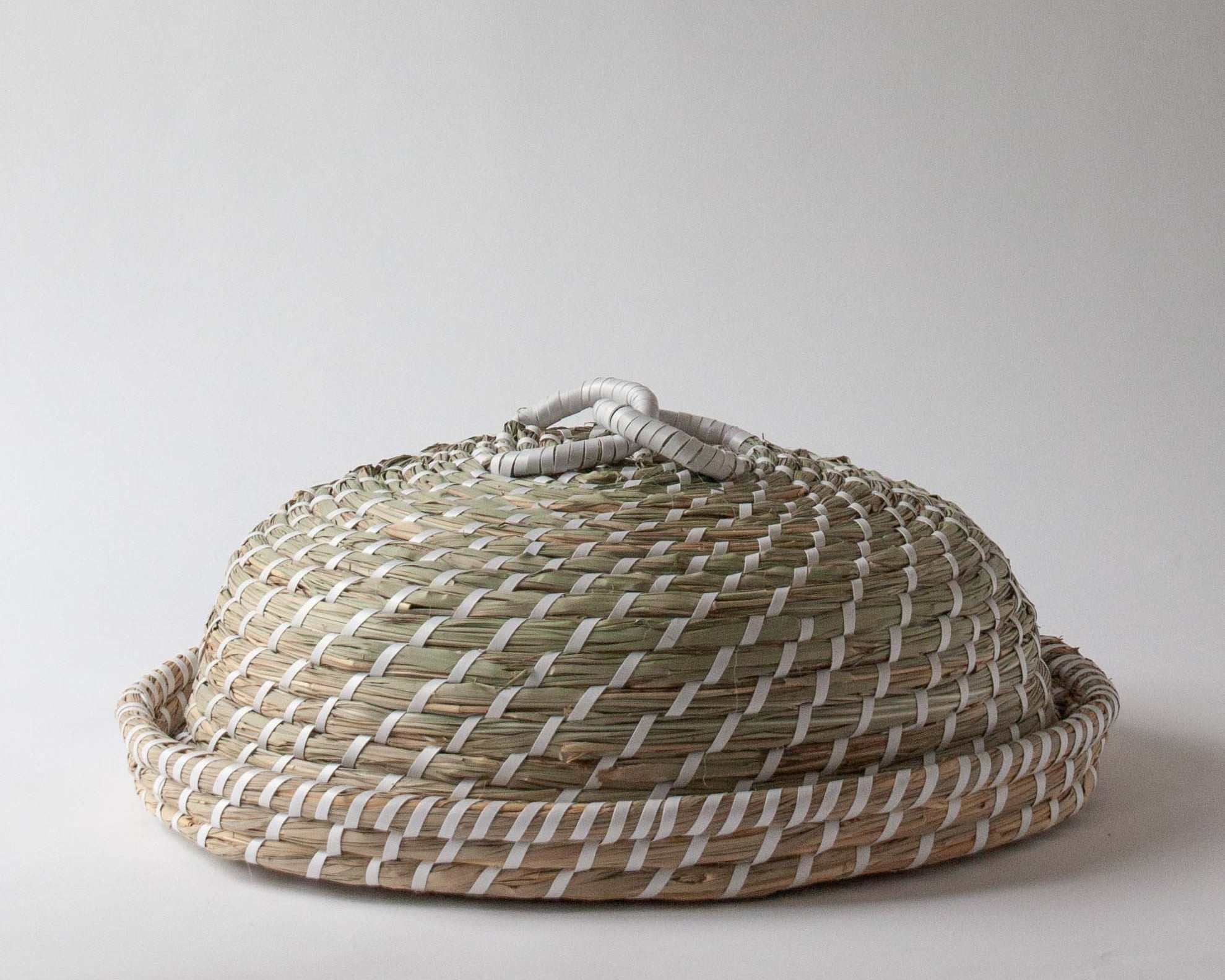 Hand woven from seagrass this luxury food cover cloche dome | Anboise