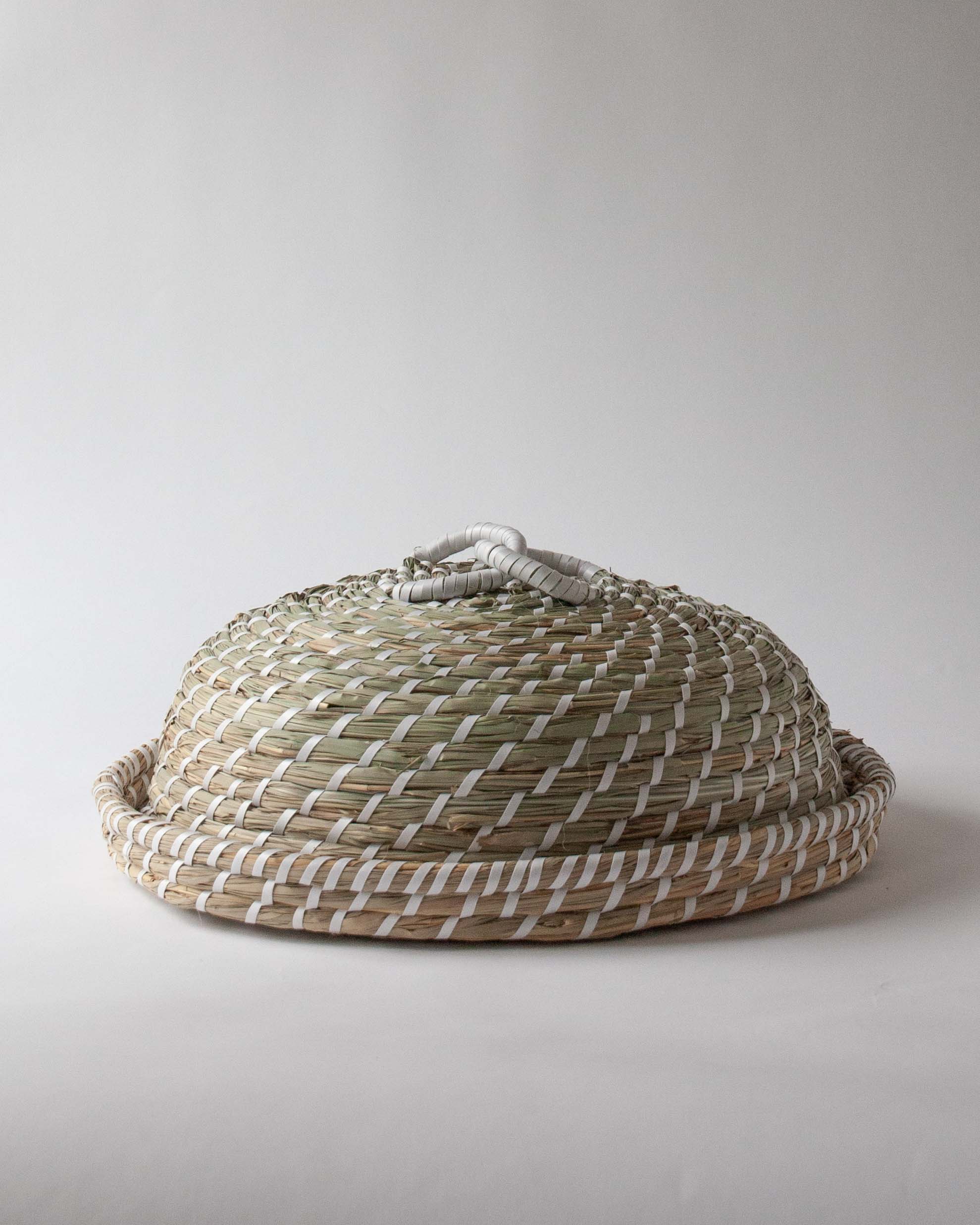 Hand woven from seagrass this luxury food cover cloche dome | Anboise