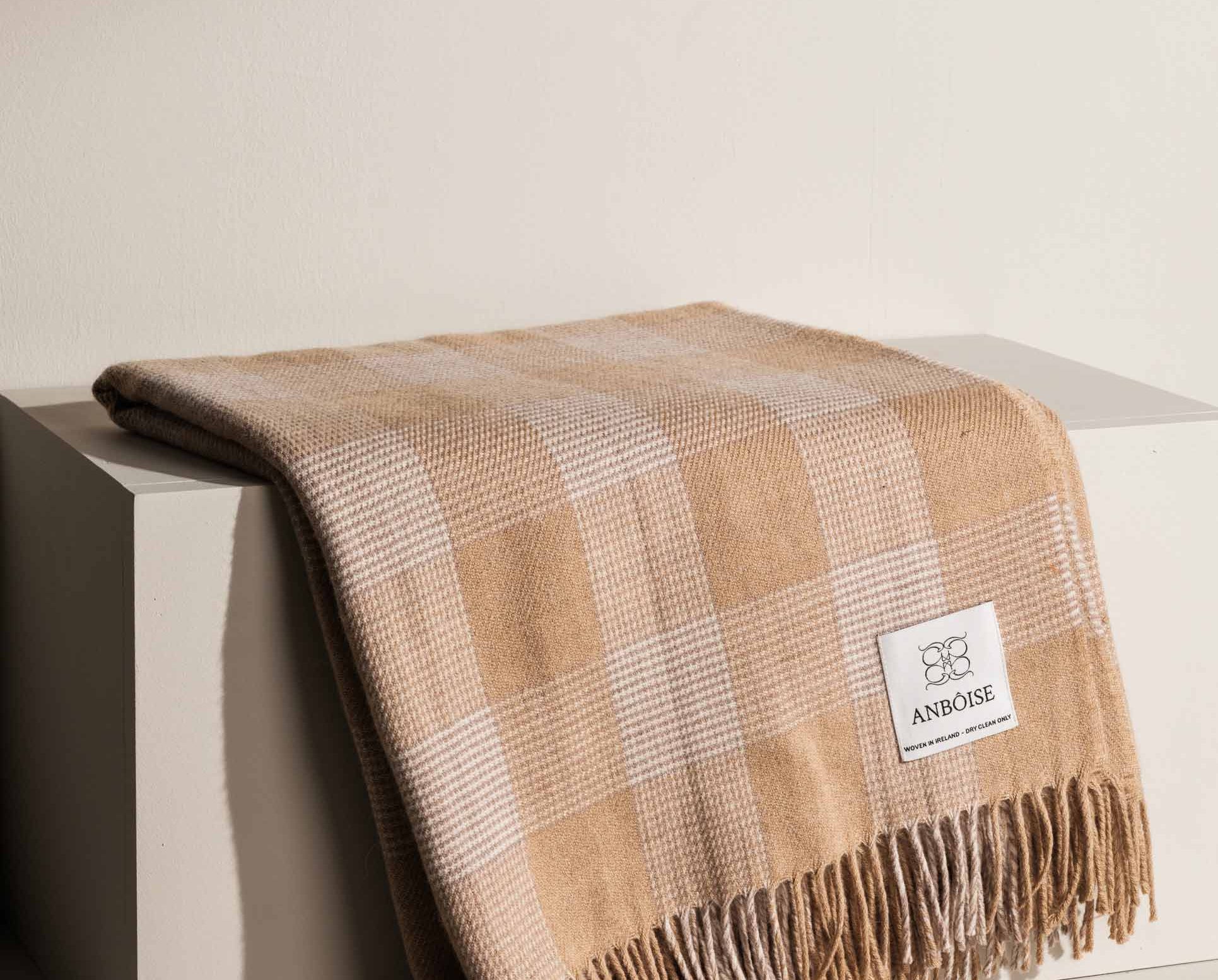 Cream Merino throw with subtle check and fringe detailing - Anboise