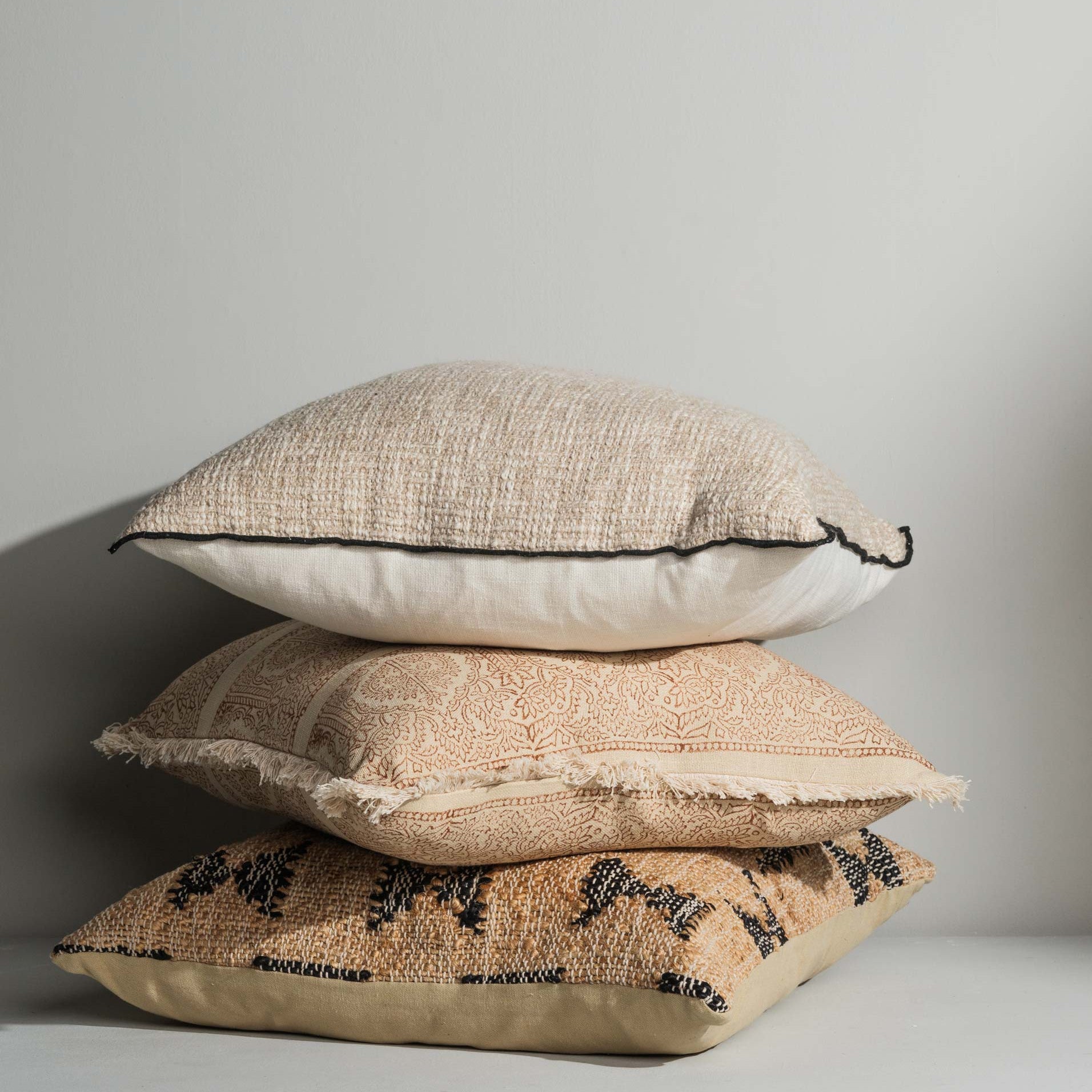 Close‑up of block print detailing and fringe trims - Anboise Cushions