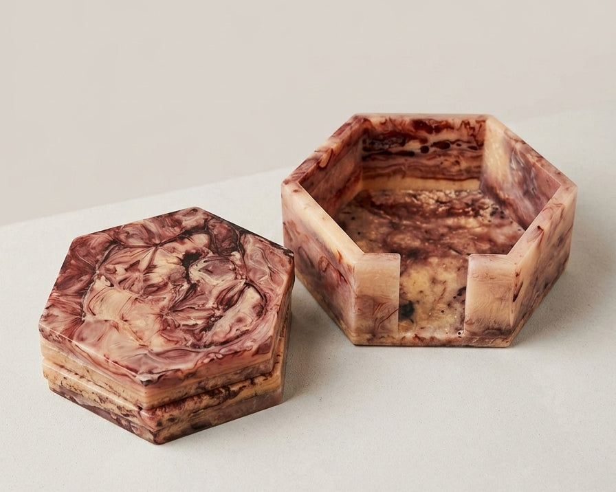 Close‑up of marbled resin coasters in hexagonal shape | Anboise