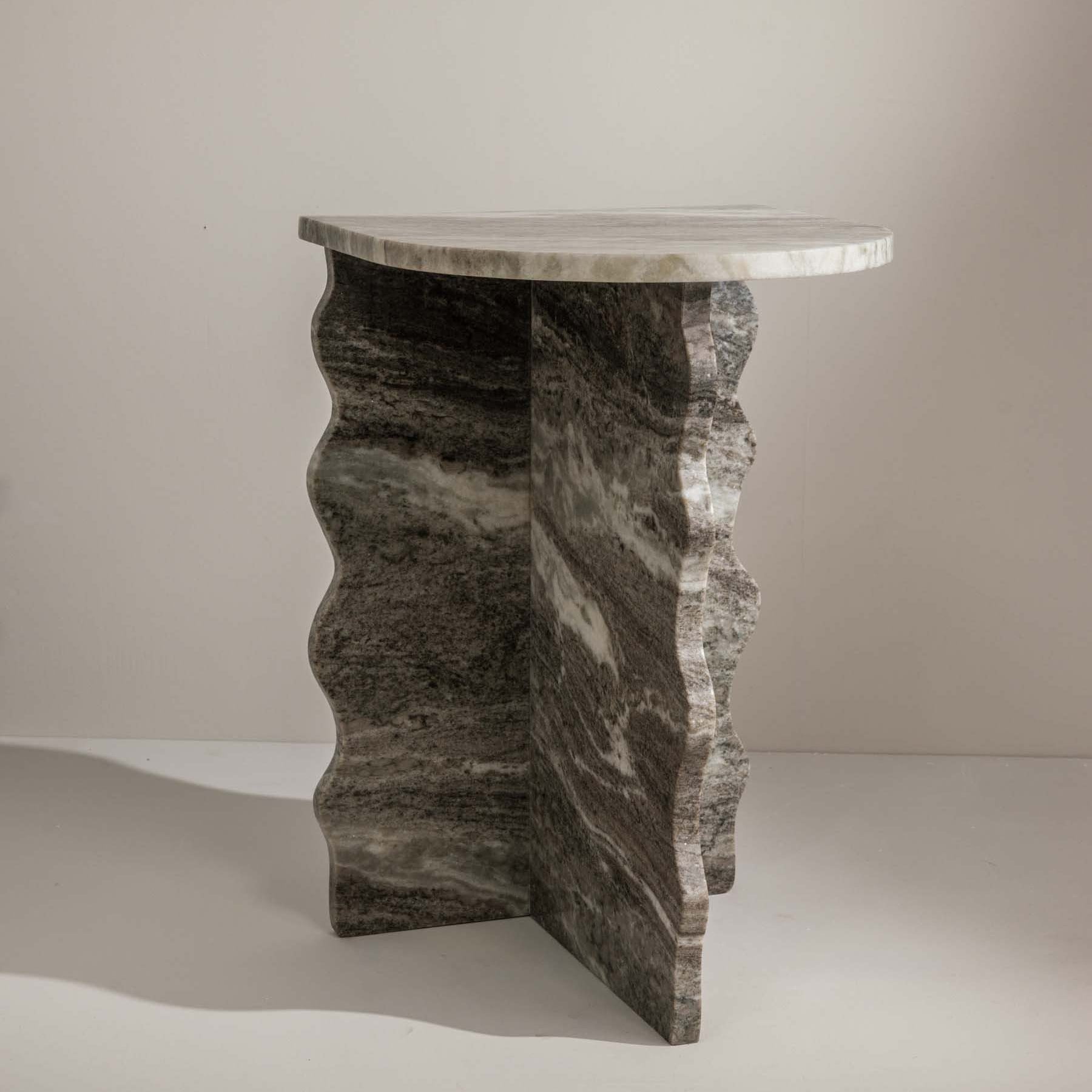 Sculptural grey marble side table with elegant silhouette