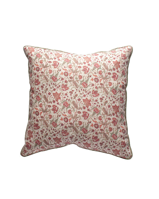 A square cushion with a floral pattern in beige and red colors.
