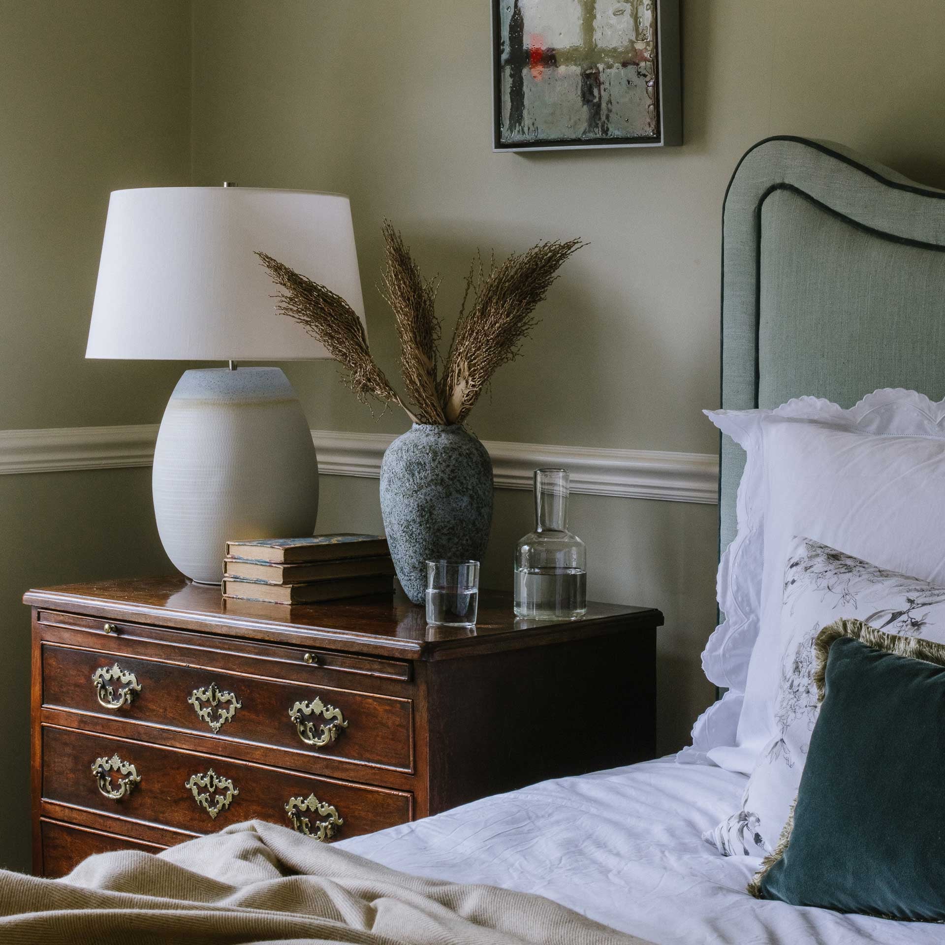 Cream Merino throw draped over a bed – Anboise