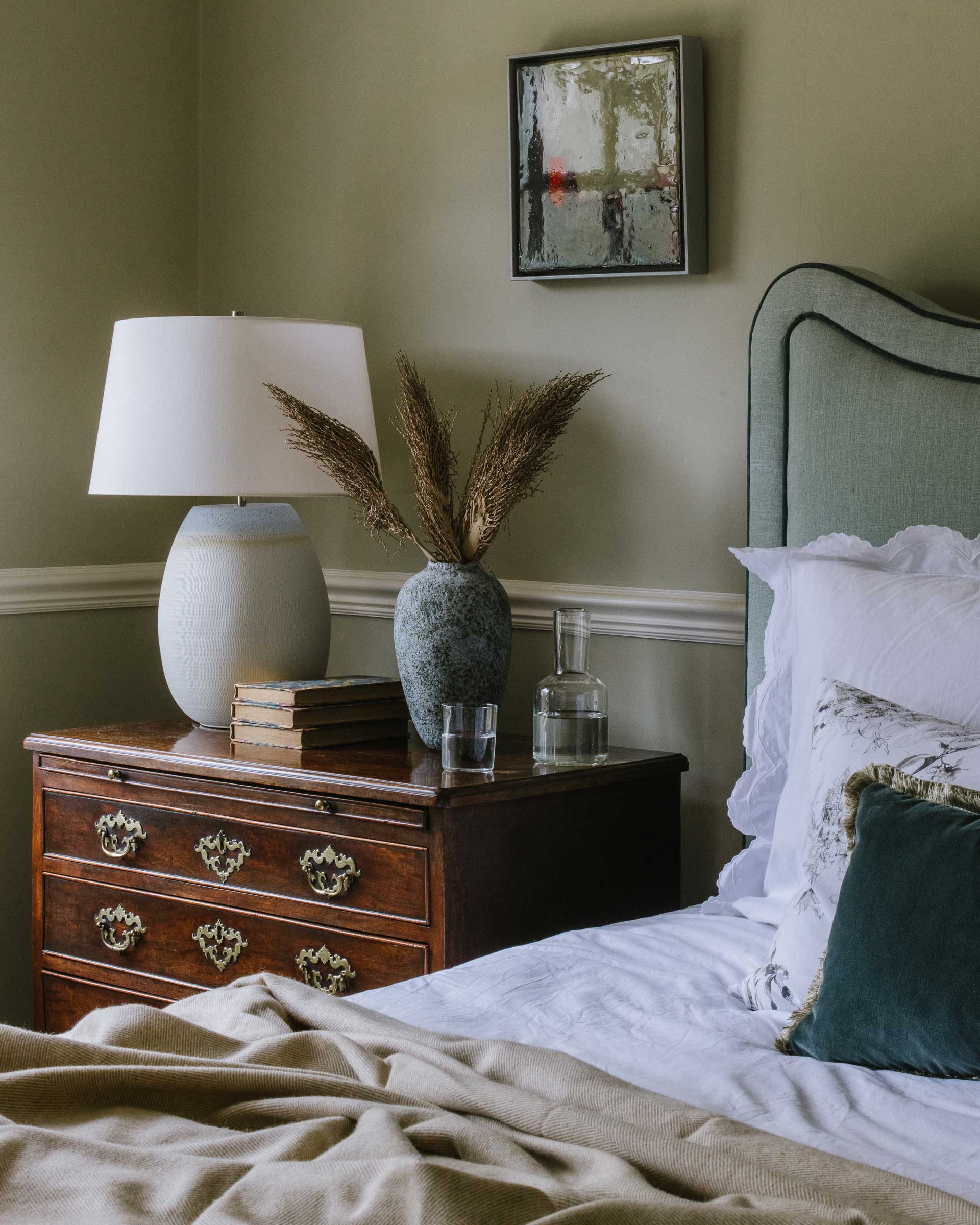 Cream Merino throw draped over a bed – Anboise
