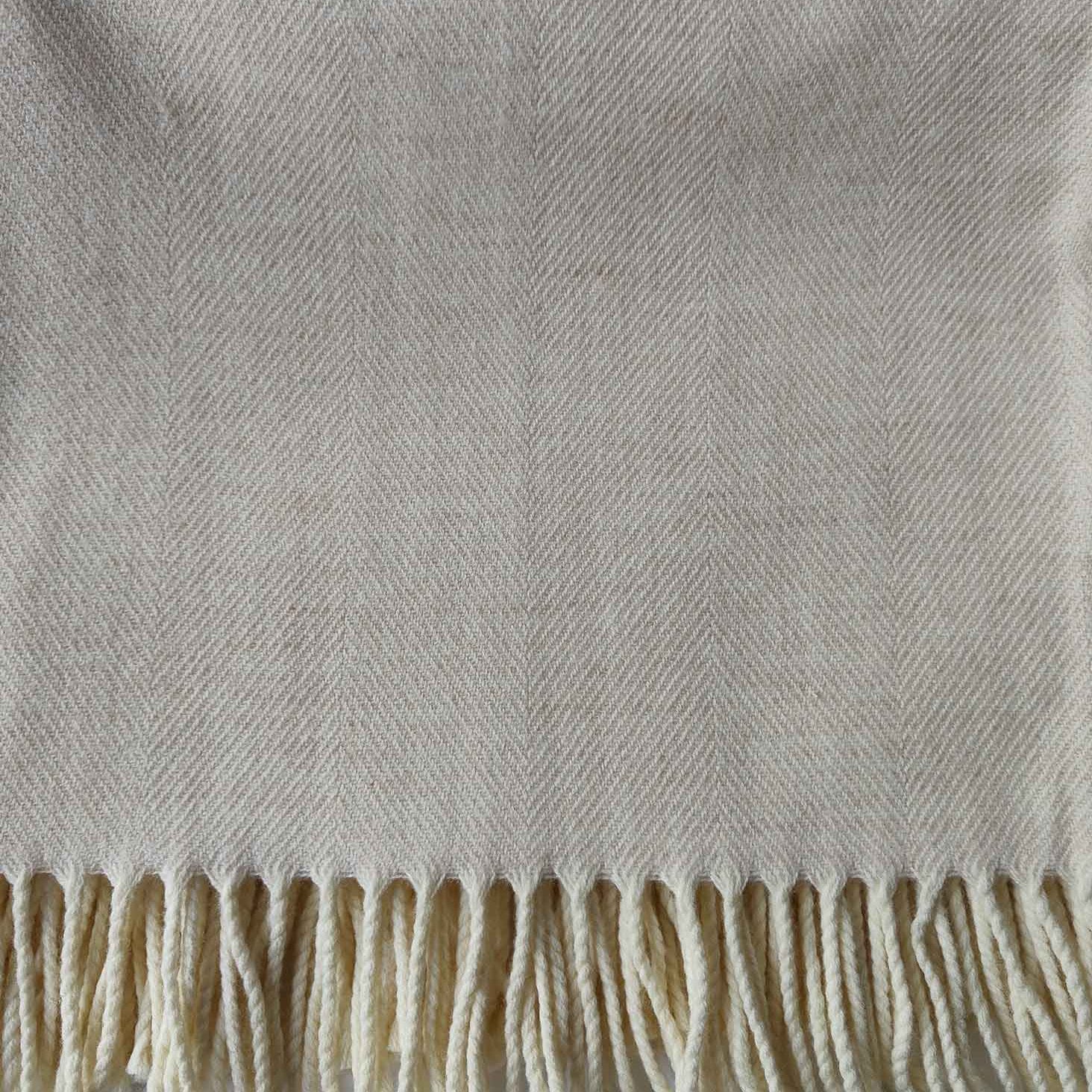 Close‑up of soft cream Merino weave and texture - Anboise