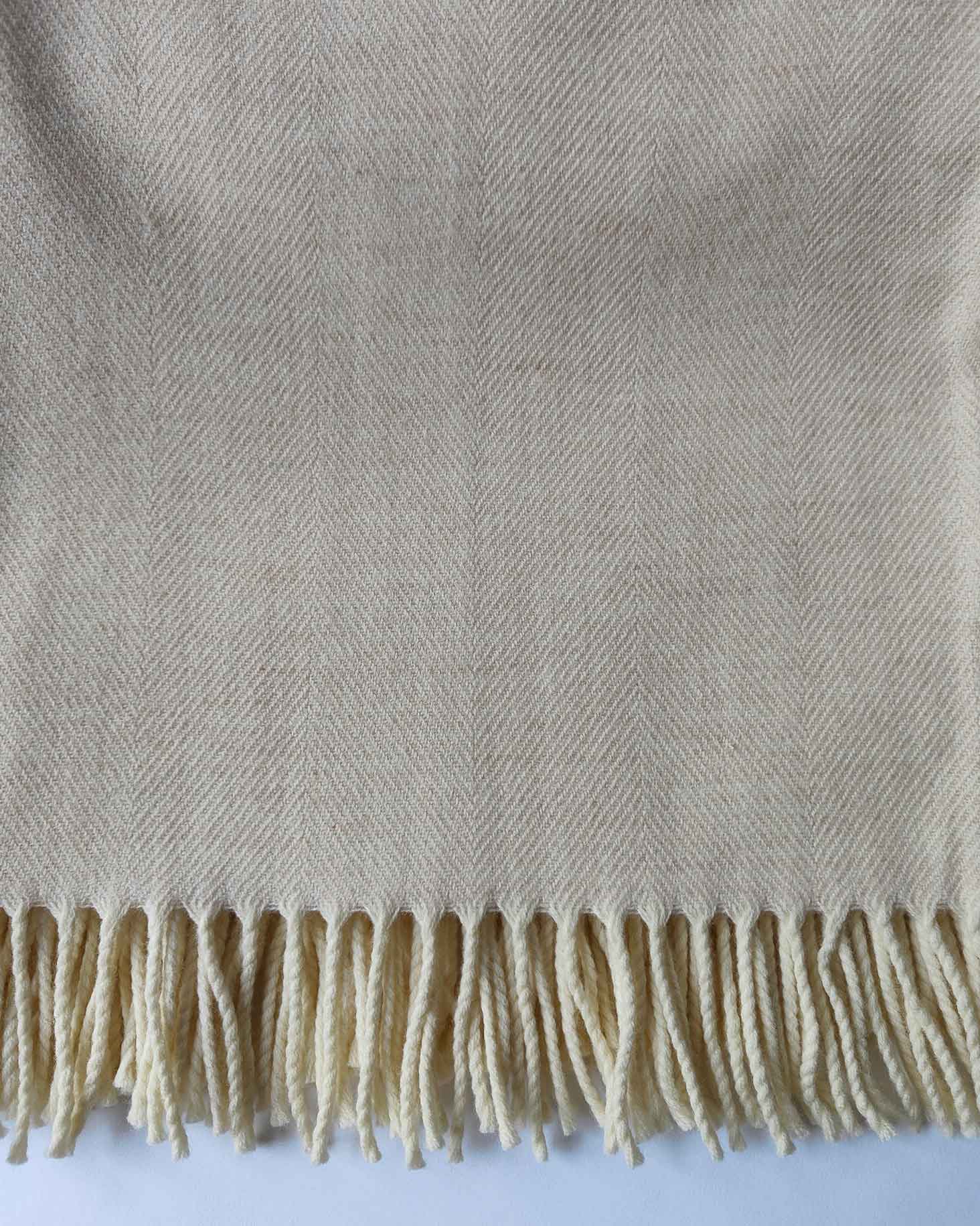 Close‑up of soft cream Merino weave and texture - Anboise